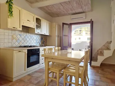 Cucina o angolo cottura di Le Melodie - Appartamenti con spazi esterni privati a Sos Alinos