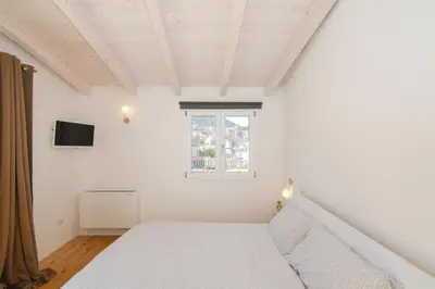 Letto o letti in una camera di Tatta & Nanna Rooms