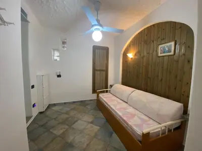 Letto o letti in una camera di Bilo Vista Mare Agrustos