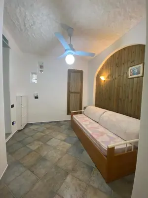 Letto o letti in una camera di Bilo Vista Mare Agrustos