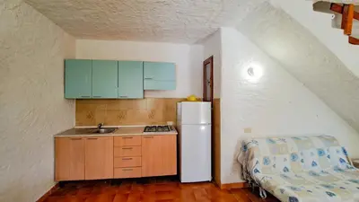 Cucina o angolo cottura di Appartamento Residenziale Trilocale 4 posti letto via Loiri