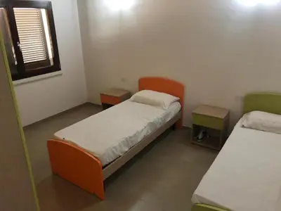 Letto o letti in una camera di Trilocale con cortile