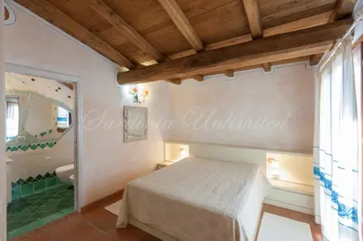 Letto o letti in una camera di Villa Danza dei Fenicotteri