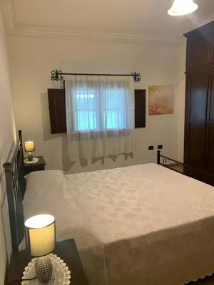 Letto o letti in una camera di VILLA LUPINO