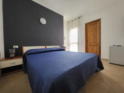 Letto o letti in una camera di White Sand affittacamere