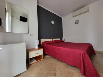 Letto o letti in una camera di White Sand affittacamere