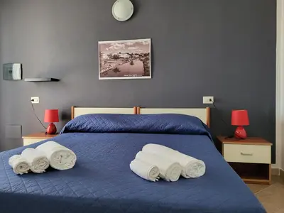 Letto o letti in una camera di White Sand affittacamere