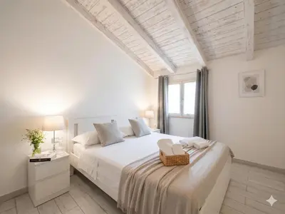Letto o letti in una camera di San Paolo Rooms
