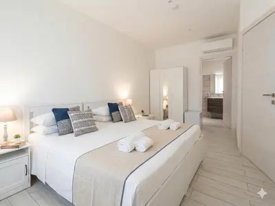 Letto o letti in una camera di San Paolo Rooms