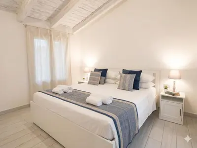 Letto o letti in una camera di San Paolo Rooms