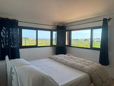 Letto o letti in una camera di Appartamento vista mare