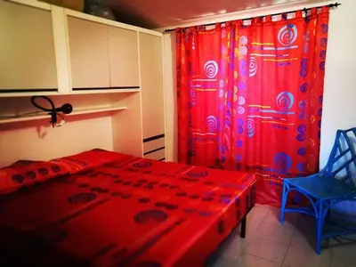 Letto o letti in una camera di Casa Gianni Cala Gonone Mare