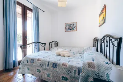 Letto o letti in una camera di Casa Murru