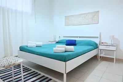 Letto o letti in una camera di Downtown Garden Olbia