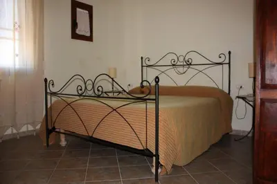 Letto o letti in una camera di SanTeodoroHome