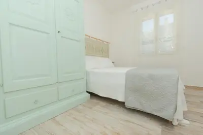 Letto o letti in una camera di Casa Ono - Appartamento con 2 Camere e 2 bagni in centro abitato