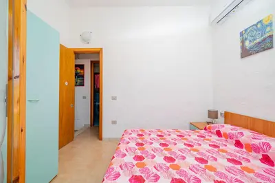 Letto o letti in una camera di Appartamento Residenziale Trilocale 4 posti letto via Oristano