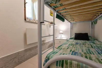 Letto o letti in una camera di Casa Marinella