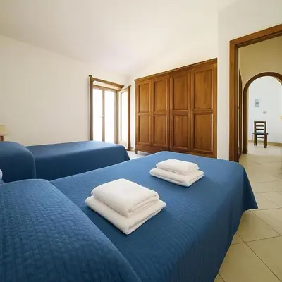 Letto o letti in una camera di Casa Vacanze Orosei
