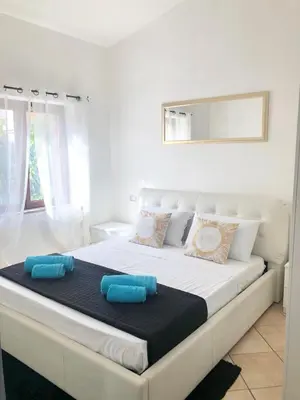 Letto o letti in una camera di International House San Teodoro