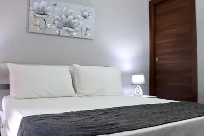 Letto o letti in una camera di 13 Garden Rooms