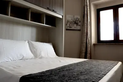 Letto o letti in una camera di 13 Garden Rooms