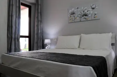 Letto o letti in una camera di 13 Garden Rooms