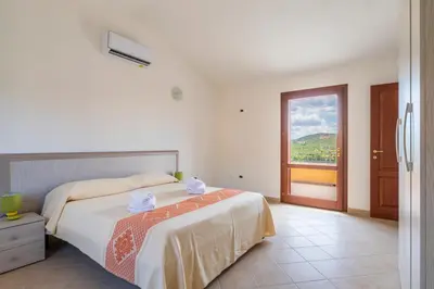 Letto o letti in una camera di Residence Corte di Gallura