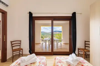 Letto o letti in una camera di Residence Corte di Gallura