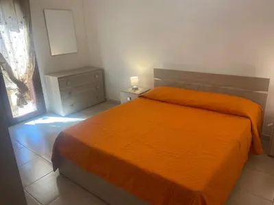 Letto o letti in una camera di Le Villette di Budoni e dintorni