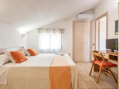 Letto o letti in una camera di Bed and Breakfast Dorgali