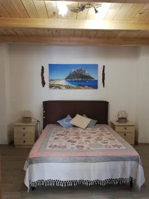 Letto o letti in una camera di Casa Tommy