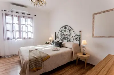 Letto o letti in una camera di Appartamento San Teodoro centro