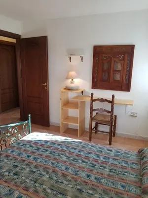 Letto o letti in una camera di Villa Su Trechesu