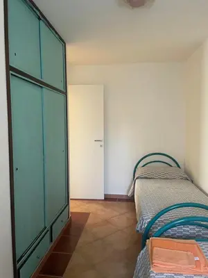 Letto o letti in una camera di Villa Su Trechesu