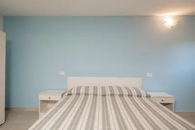 Letto o letti in una camera di Residence Li Menduli