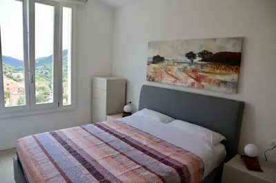 Letto o letti in una camera di neues Haus mit beheiztem Pool