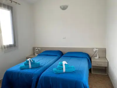 Letto o letti in una camera di Case Vacanza Onda e Riva