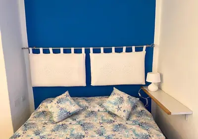 Letto o letti in una camera di San Teodoro Punta Est Delizioso Monolocale Vista Mare