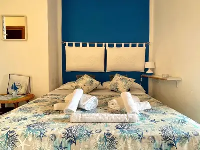Letto o letti in una camera di San Teodoro Punta Est Delizioso Monolocale Vista Mare