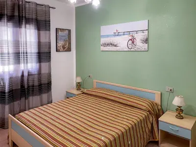 Letto o letti in una camera di Casa Carola Quadrilocale 4 posti letto
