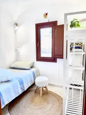 Letto o letti in una camera di Domo Mea Terra e Domo Mea Chelu - Comfort nel centro storico di Orosei