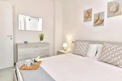 Letto o letti in una camera di Residence Chiaro di Luna