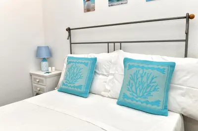 Letto o letti in una camera di Residence Chiaro di Luna