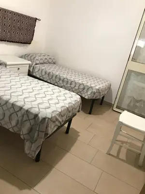 Letto o letti in una camera di Casa Speranza