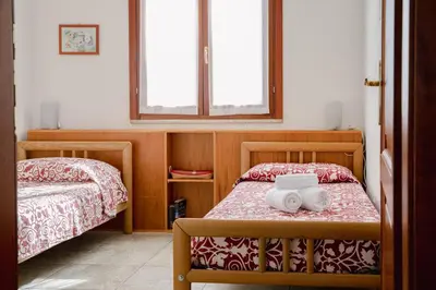 Letto o letti in una camera di APP.TO VIA MARE - BUDONI SWEET HOME