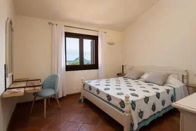 Letto o letti in una camera di Le case del golfo - Your House in Sardinia