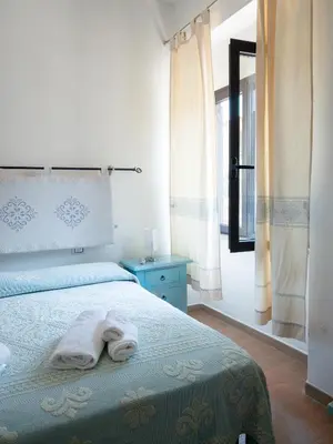 Letto o letti in una camera di Affittacamere Zia Maria