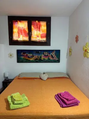 Letto o letti in una camera di Appartamento accogliente