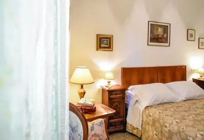 Letto o letti in una camera di Casa Marta IUN Q1985